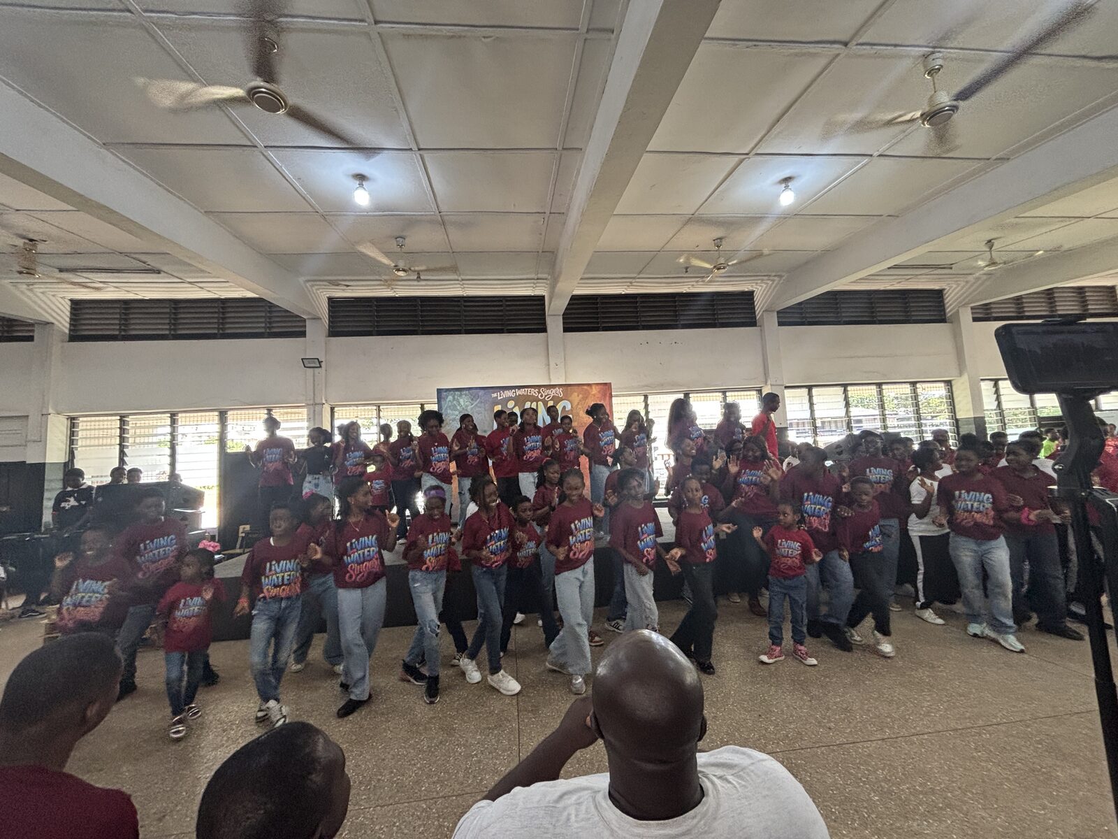 Living Waters members gathered for a performance indoors