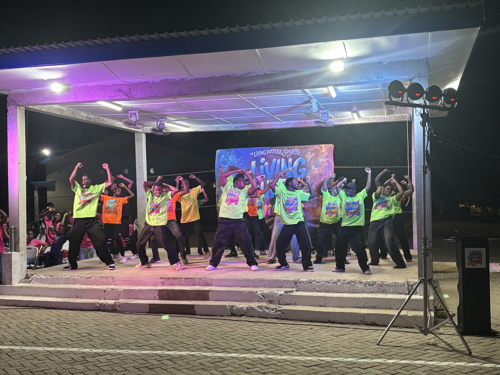 Living Waters Dancers performing on stage at night