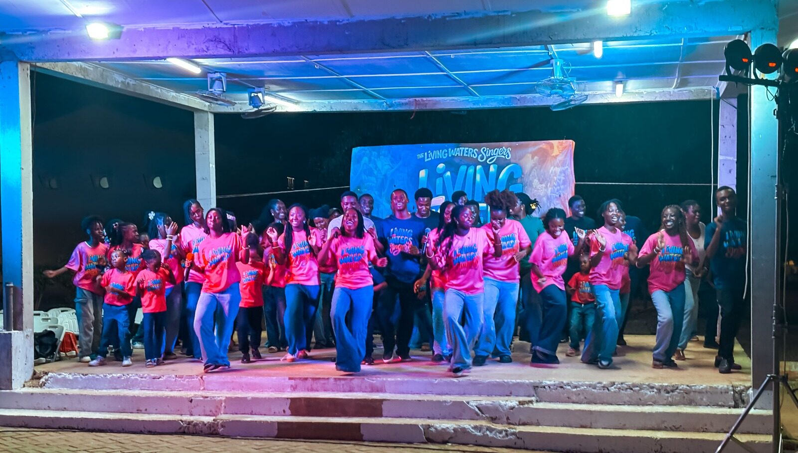 Living Waters Singers in black on stage
